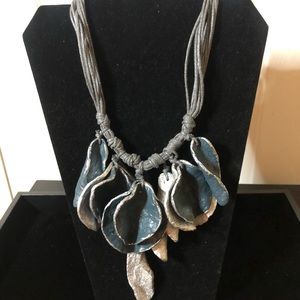 Blue and grey leather necklace.